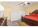 A bedroom with an area rug, hardwood floors, a ceiling fan and a closet at 2417 Cumberland Cliff Dr, Ruskin, FL 33570