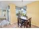 Cozy dining area with view of the pool, featuring a modern table and chairs at 2417 Cumberland Cliff Dr, Ruskin, FL 33570