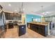 Well-appointed kitchen with stainless steel appliances, tile flooring, granite countertops and an open layout at 2417 Cumberland Cliff Dr, Ruskin, FL 33570