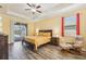 The main bedroom has sliding glass doors to the pool and a view to the outside at 2417 Cumberland Cliff Dr, Ruskin, FL 33570