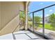 Screened patio with view to the neighborhood featuring green grass, trees, and other houses at 2417 Cumberland Cliff Dr, Ruskin, FL 33570