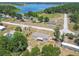 Aerial view of a newly fenced home surrounded by trees in a lakeside neighborhood providing peaceful and private outdoor living at 25126 Huston St, Brooksville, FL 34601