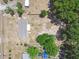 Aerial view of a fenced in home with a large, empty lot at 25126 Huston St, Brooksville, FL 34601