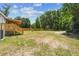 A sprawling backyard with a wooden deck and stairs, enhanced by an adjacent AC unit at 25126 Huston St, Brooksville, FL 34601