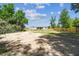 Expansive fenced backyard view of the newly renovated home with trees and landscaping opportunities at 25126 Huston St, Brooksville, FL 34601