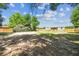 A spacious, partly shaded backyard offering potential for various outdoor activities and landscaping at 25126 Huston St, Brooksville, FL 34601