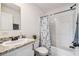 Bathroom featuring a vanity with granite countertop, shower-tub combination, and neutral-toned walls at 25126 Huston St, Brooksville, FL 34601