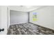 A bright bedroom with wood grain flooring and a window providing natural light with neutral wall colors at 25126 Huston St, Brooksville, FL 34601