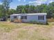 Lovely single-story home with a landscaped yard and attractive entrance at 25126 Huston St, Brooksville, FL 34601