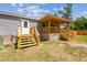 Home exterior features a covered porch, stairs and newly installed grey siding at 25126 Huston St, Brooksville, FL 34601