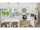 Modern kitchen with a center island, granite countertops, and stainless steel appliances at 25126 Huston St, Brooksville, FL 34601