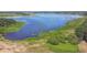 Picturesque view of a lake and tree-lined shoreline at 25126 Huston St, Brooksville, FL 34601