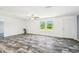 Living room with modern wood flooring, natural light, neutral paint and a ceiling fan at 25126 Huston St, Brooksville, FL 34601