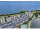 Expansive aerial view of condo complex near the bay, with parking and a swimming pool at 2617 Cove Cay Dr # 401, Clearwater, FL 33760