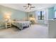 Bright bedroom with desk, carpet and lots of natural light from the windows at 2617 Cove Cay Dr # 401, Clearwater, FL 33760