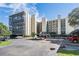 Multi-story condo building with balconies and covered parking, showcasing community living at 2617 Cove Cay Dr # 401, Clearwater, FL 33760