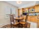Inviting dining area featuring a round table, wood chairs, and bright natural light at 2617 Cove Cay Dr # 401, Clearwater, FL 33760