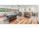 Well-lit game room featuring a pool table, seating, natural light, and light wood flooring at 2617 Cove Cay Dr # 401, Clearwater, FL 33760