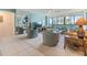 Spacious living room features lots of seating, carpet, and views of the outdoors at 2617 Cove Cay Dr # 401, Clearwater, FL 33760