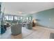Large living room featuring tile flooring, comfortable seating, and outdoor views at 2617 Cove Cay Dr # 401, Clearwater, FL 33760