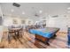 Large recreation room featuring tables, chairs, and a pool table at 2617 Cove Cay Dr # 401, Clearwater, FL 33760