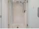 White tiled glass shower with chrome shower head and hardware inside a residential home at 2617 Cove Cay Dr # 401, Clearwater, FL 33760