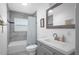 Updated bathroom features a marble tiled wall, patterned floor and modern vanity at 267 Broad St, Brooksville, FL 34604