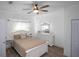 Bright bedroom with light-colored walls, wood-look flooring, and a ceiling fan at 267 Broad St, Brooksville, FL 34604