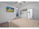 Bright bedroom with TV and steps leading to another room at 267 Broad St, Brooksville, FL 34604