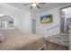 Bright bedroom with TV and a small step-up to another room at 267 Broad St, Brooksville, FL 34604