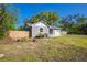 Charming home with a fenced yard and a well-maintained lawn, offering a private and inviting outdoor space at 267 Broad St, Brooksville, FL 34604