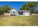Charming home featuring a lush lawn, fenced yard, and inviting exterior, blending comfort with outdoor enjoyment at 267 Broad St, Brooksville, FL 34604