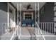 Cozy front porch offering comfortable seating and stylish decorative elements for a welcoming entry at 267 Broad St, Brooksville, FL 34604