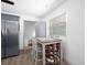 Kitchen with a cozy eating area featuring gray-painted walls, a wine rack, and an adjacent bathroom at 267 Broad St, Brooksville, FL 34604