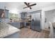 Modern kitchen boasts gray cabinetry, stainless-steel appliances, and stylish backsplash, perfect for cooking at 267 Broad St, Brooksville, FL 34604