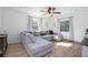 Sun-filled living room showcasing a large sectional sofa, modern flooring, and ample natural light at 267 Broad St, Brooksville, FL 34604