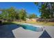 Backyard featuring a refinished pool with a lush green grass area and privacy fence at 267 Broad St, Brooksville, FL 34604