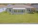 Lush backyard with a screened-in lanai and well-maintained lawn; ideal for relaxation and outdoor activities at 29436 Zeller Ave, San Antonio, FL 33576