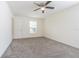 Bedroom features a window for natural light and a ceiling fan at 29436 Zeller Ave, San Antonio, FL 33576