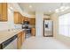Bright kitchen features stainless steel appliances, oak cabinets, and tile flooring at 29436 Zeller Ave, San Antonio, FL 33576