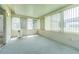 Bright, enclosed lanai with multiple windows offering ample natural light and versatile space at 29436 Zeller Ave, San Antonio, FL 33576