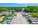 Wide angle aerial of community RV storage with lake access and nearby residential homes at 2961 Briar Cliff Dr, Palm Harbor, FL 34684