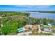 Aerial view of community pool, picnic area and lake at 2961 Briar Cliff Dr, Palm Harbor, FL 34684