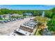 Wide angle aerial view of community RV storage on lake in residential area at 2961 Briar Cliff Dr, Palm Harbor, FL 34684