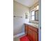 Bathroom featuring neutral walls, tile floor, vanity with granite countertop, and wood cabinets at 2961 Briar Cliff Dr, Palm Harbor, FL 34684