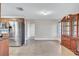Open dining area adjacent to the kitchen, offering ample space for entertaining and a traditional hutch at 2961 Briar Cliff Dr, Palm Harbor, FL 34684