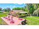 Exterior view of building with a community picnic area and BBQ grills at 2961 Briar Cliff Dr, Palm Harbor, FL 34684