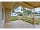 Inviting front porch with brick supports, wooden railing, and paver flooring, offering a cozy outdoor space at 2961 Briar Cliff Dr, Palm Harbor, FL 34684