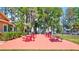 Community picnic area featuring multiple tables and BBQ grills at 2961 Briar Cliff Dr, Palm Harbor, FL 34684