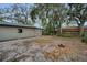 Expansive backyard offering tranquility and natural beauty with room for expansion at 306 S Highland Ave, Clearwater, FL 33755